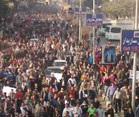 Crowded street in Egypt packed with protesters walking