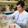 Male researcher works with test samles in lab