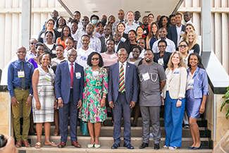Dr. Fred Ssewamala, ICHAD Founding Director; Barnabas Nawangwe, Vice Chancellor, Makerere University; and Dr. Noeline Nakasujja, Associate Professor, Chair of the Department of Psychiatry, College of Health Sciences, Makerere University, with ICHAD team members, research training program fellows, and partners at the Forum on Child and Adolescent Global Health Research and Capacity Building, in Kampala, Uganda in June 2022.