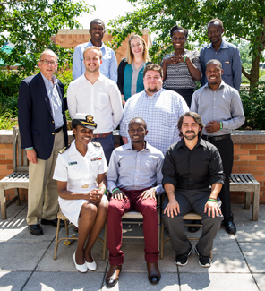 Dr. Roger Glass poses with the 2017 fellows and scholars cohort