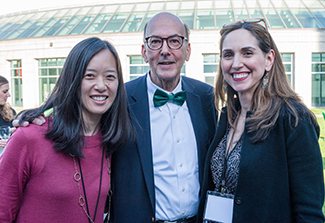 Dr. Roger Glass poses with former Fellows Drs. Evelyn Hsieh and Laura Lewandowski at Fogarty’s 50th Anniversary celebration