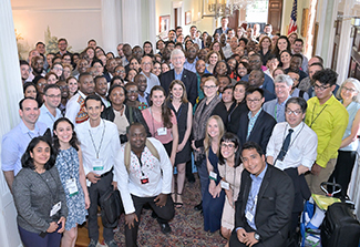 Fellows and scholars pose with Fogarty and NIH staff at a reception in 2019.