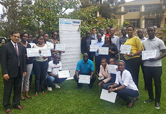 Researchers from the University of Rwanda pose with Dr. Adebola Adedimeji at a Research administration and grants management workshop in Kigali.