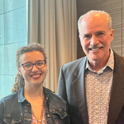 Acting Fogarty Director Peter Kilmarx (right) with Alonya Mazhanaya (left) smiling in Warsaw, Poland in June 2023.