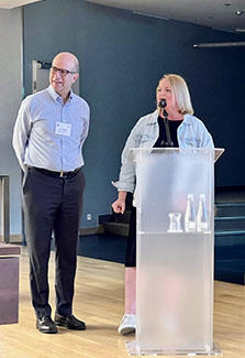 Anna Meteliuk, (right) with Jack Dehovitz (left) speaking in Warsaw, Poland in June 2023.