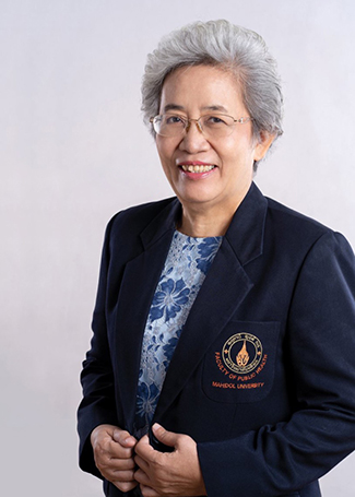 This photograph is a headshot of Dr. Pornpimol Kongtip who is smiling and wearing a blue floral pattern blouse under a navy suit with the Mahidol University crest.