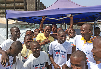 Dr. Soka Moses smiling with other volunteers.
