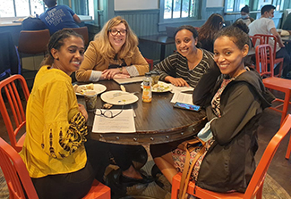 The picture shows the Ethiopian fellows at dinner.