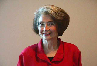 Photo of Lois Cohen wearing a rest top and smiling