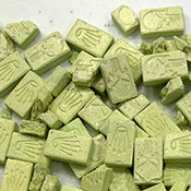 Photo of Ecstasy pills scattered on a table