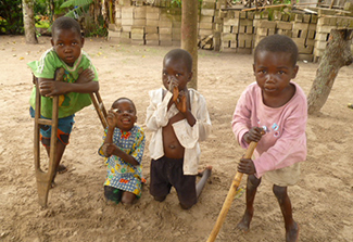 This photo shows a group of four young children, all living with konzo.