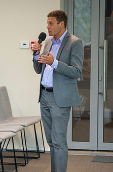 Adam Levine speaking with microphone