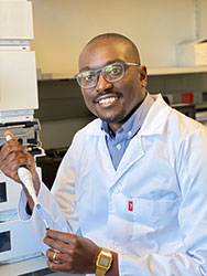 Dr. Admire Dube working in a lab.