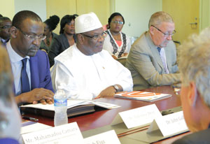 Mali President Ibrahim Boubacar Keïta and Zambian VP Guy Scott seated at conference table across from NIH leaders
