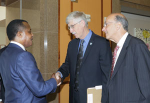 Republic of the Congo President Denis Sassou Nguesso shakes hands with NIH Dir Francis Collins, Fogarty Dir Dr Glass looks on