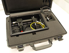 Open briefcase shows padding, wrapped up inside is wires with a fiber-optic probe