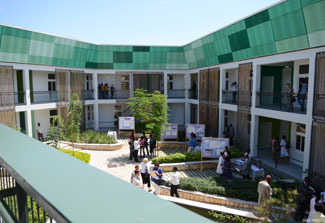 Courtyard of the new TB hospital in Port-au-Prince, Haiti, balcony walkway overlooks central atrium