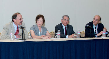 Seated at conference panel table with microphone NCI Harold Varmus, NIEHS Linda Birnbaum, NIAID Tony Fauci, Fogarty Roger Glass