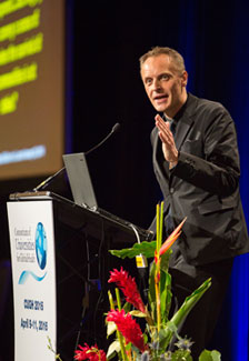 The Lancet's editor Dr. Richard Horton speaks at a podium during the CUGH 2016 conference