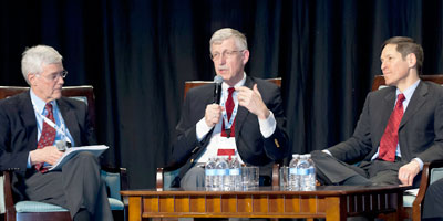 NIH Director Dr Francis Collins speaks as a part of a panel during the CUGH conference, one man seated on each side of him