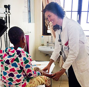 Dr. Dorothy Dow examines a young patient in an exam room