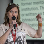 Emily Anderson speaking with microphone