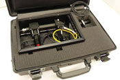 Open briefcase shows padding, wrapped up inside is wires with a fiber-optic probe