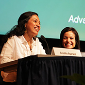 Anubha Agarwal (left) speaks during the Fogarty Global Health Fellows & Scholars 20th Anniversary event on April 13, 2023, at NIH's Natcher Center. Roxanna Garcia(right) looks on.