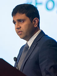 Dr. Vivek Naranbhai speaking at a podium