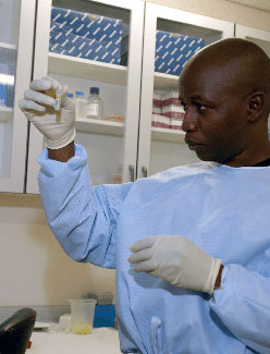 Simani Gaseitsiwe working in a lab.