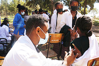 A 14-year-old girl receives and HPV vaccine at her school in  Addis Ababa, January 2022