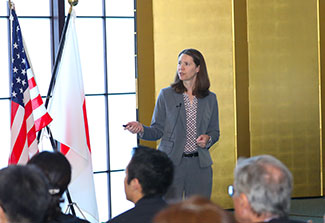 Dr. Diane Lidke presents at the front of the room during the HFSP 30th anniversary event.