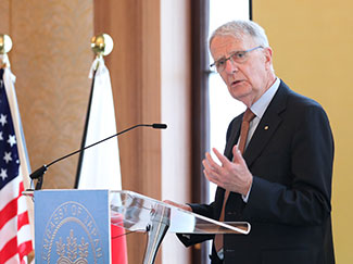 HFSP Secretary-General Professor Warwick Anderson speaks from a podium during the HFSP 30th anniversary event.