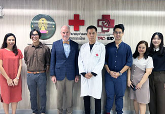 In this photo Acting Fogarty Director Peter Kilmarx (third from left) poses with staff from the Thai Red Cross Emerging Infectious Diseases Health Science Centre at Chulalongkorn University.
