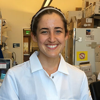 Leah Katzelnick poses for the camera in a lab.