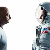 The photo shows retired astronauts Mark and Scott Kelly, identical twin brothers who participated in the NASA Twins Study