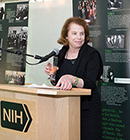 Mary McAndrew at the NIH podium at the Fogarty 50th celebration