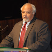 Ambassador Eric Goosby speaks at a podium