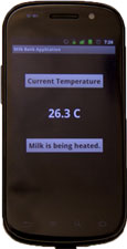 Cell phone screen shows Milk Bank Application, reads 'current temperature, 26.3 C, Milk is being heated'