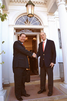 Dr. Jose Angel Portal Miranda shakes hands with Dr. Roger I. Glass on the NIH campus