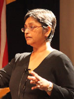 Dr. Quarraisha Abdool Karim speaks at a podium