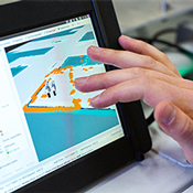 hand hovering over a table touchscreen