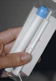 Close up of packaged tenofovir gel and applicator
