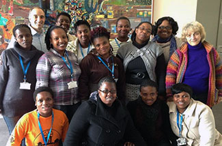 Community health workers in South Africa pose for large group photo