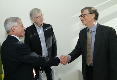 Bill Gates shakes hands with NIAID Director Dr. Anthony Fauci, NIH Director Dr. Francis Collins looks on