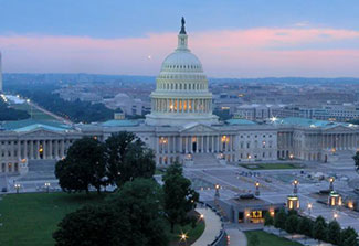 U.S. Capitol building as seen from the air in the evening.