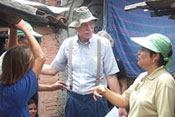 Young child hangs from empty clothesline in Brazilian slum