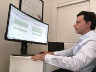 Dr Cepeda works with data on his computer screen