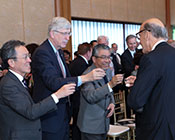 NIH and Japanese leadership raise a glass to make a toast during the HFSP 30th anniversary reception.