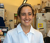 Leah Katzelnick poses for the camera in a lab.